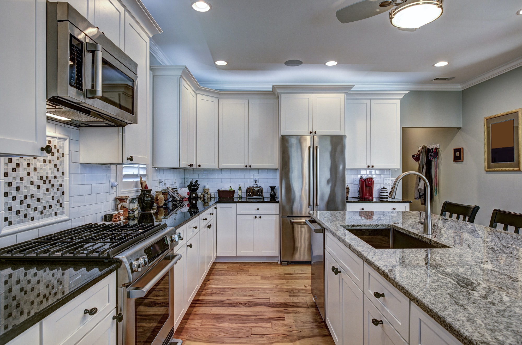 High-end luxury kitchen with granite countertops and white cabin